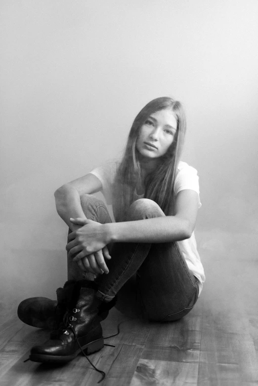 a black and white po of a girl in boots