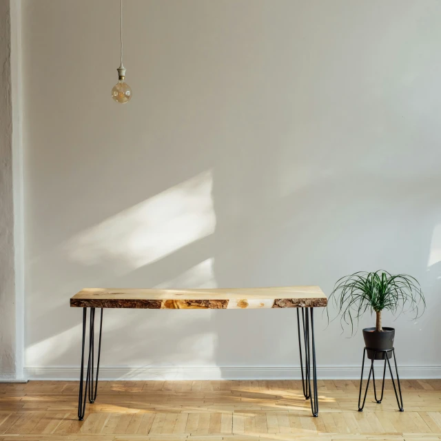 a table next to a chair with plants in it