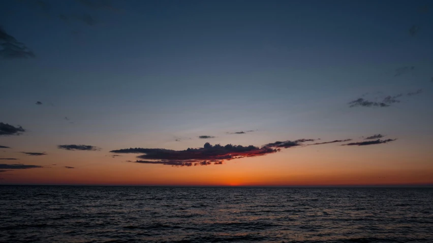 a view of a sunset on the water