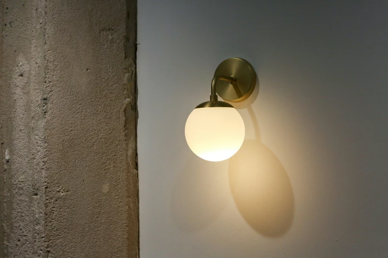 a wall light that is made of metal