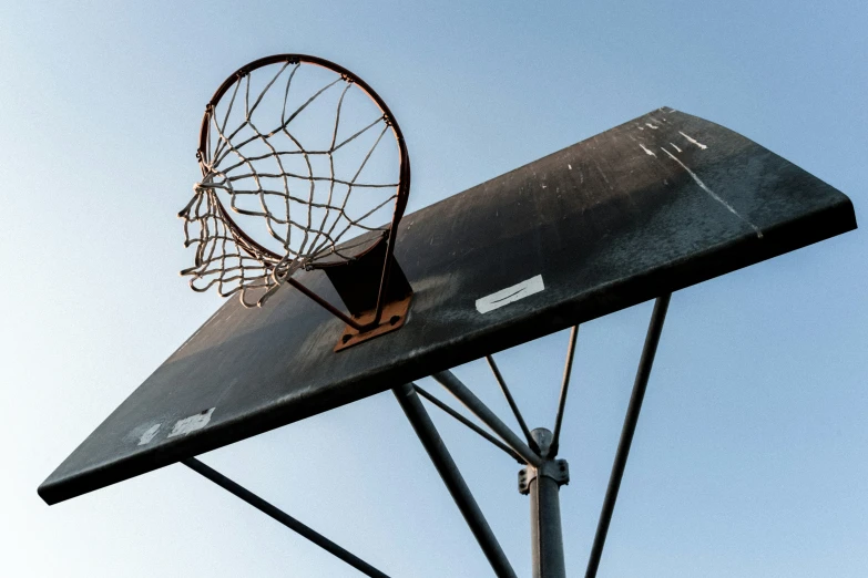 basketball hoop being held up against a pole