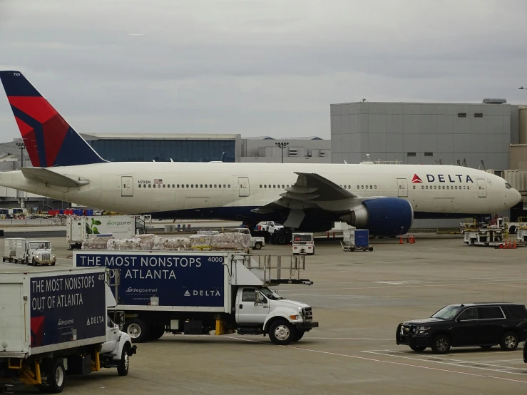 a delta jet is on the runway at an airport