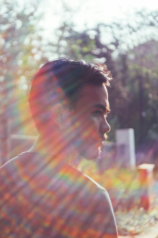 woman standing in the sunlight and looking at soing