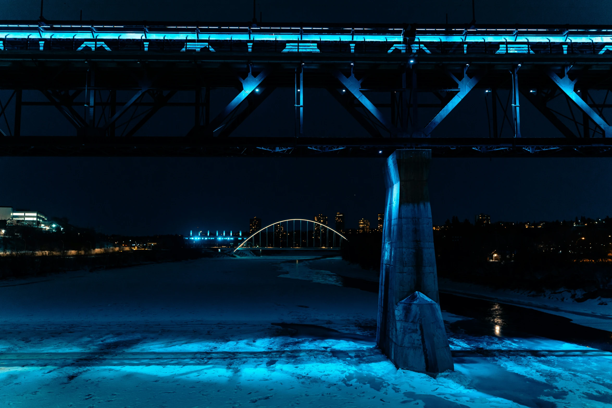 a long exposure picture of a train going over a bridge