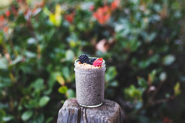 a food with fruit and a drink in a jar