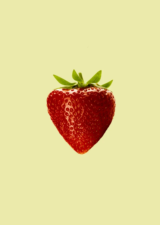 a close up image of a strawberry with a green stem