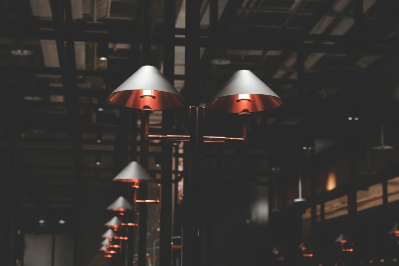 a collection of three lamps with different shades of red