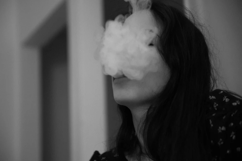 woman in white mask posing with long dark hair