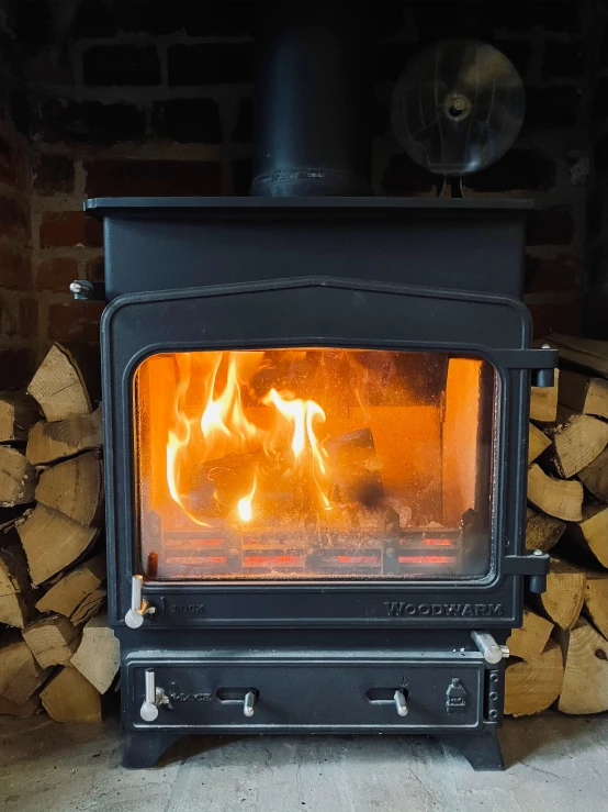 the firewood is burning and cooking in the fireplace