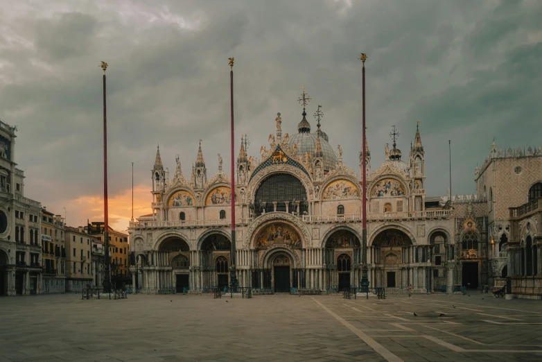 a tall cathedral sits in an empty plaza