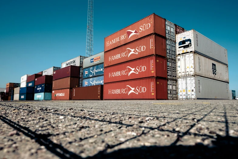 some brown red and white containers are in the dirt