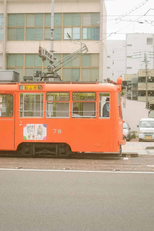 a very big nice looking colored orange bus