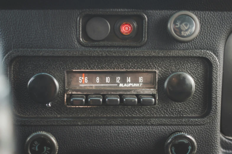 the control panel in an old black car