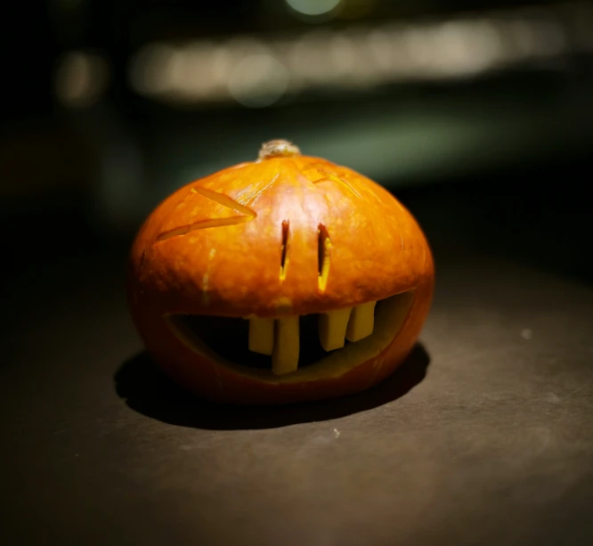 the halloween pumpkin is shaped as a mouth for teeth