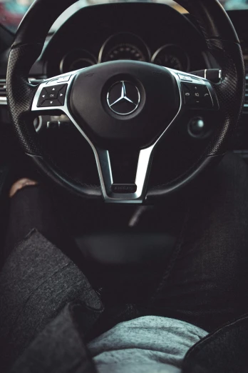 the steering wheel of a mercedes c - class car
