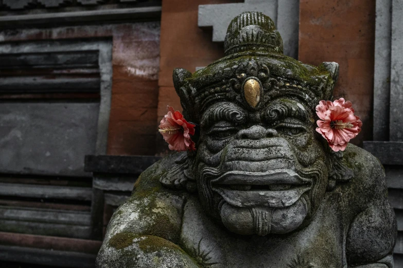 the statue has a flower in his hair