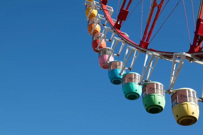 an amut ride with colorful ferris wheel spinning