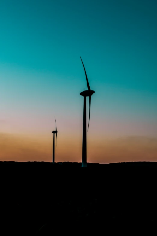 windmills on the horizon of a dusk sky