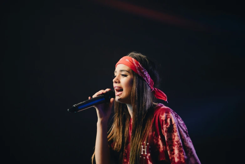 the musician wearing an indian head bandanna and a red bandanna