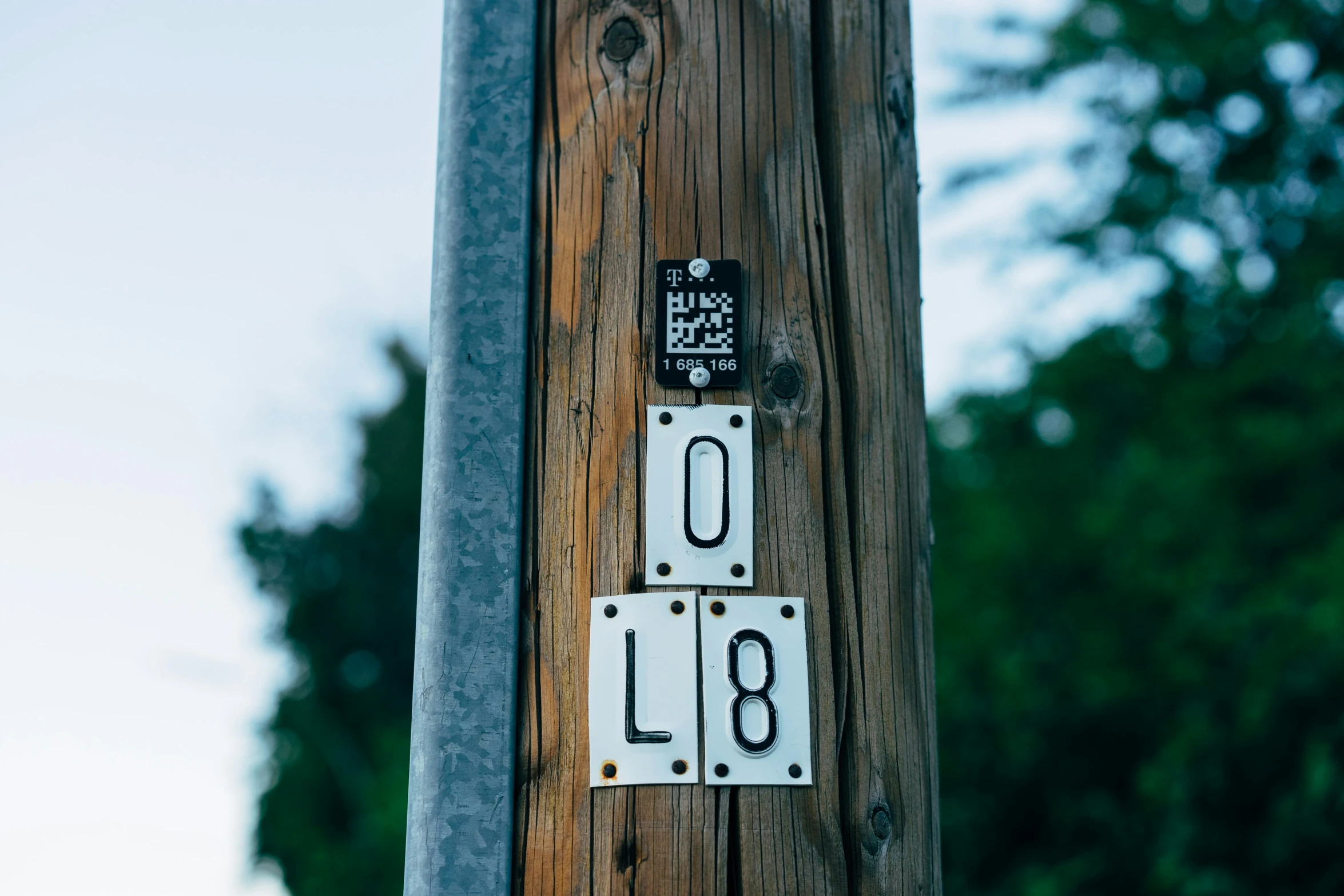 a pair of numbers on the side of a telephone pole