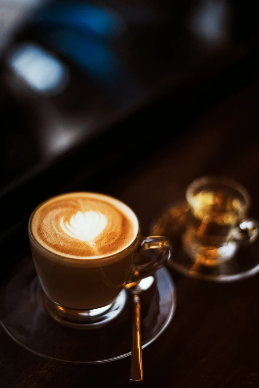 a cup of coffee with latte art in the design