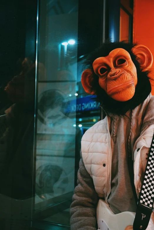 a monkey with an angry face holding onto a tie