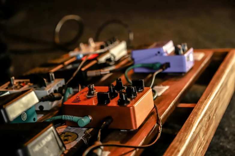 a collection of various types of pedals with one cord plugged