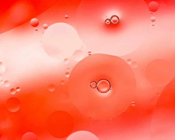 water droplets on a glass surface with a colorful background