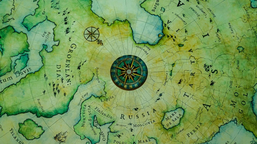 a painting with a compass on it in green