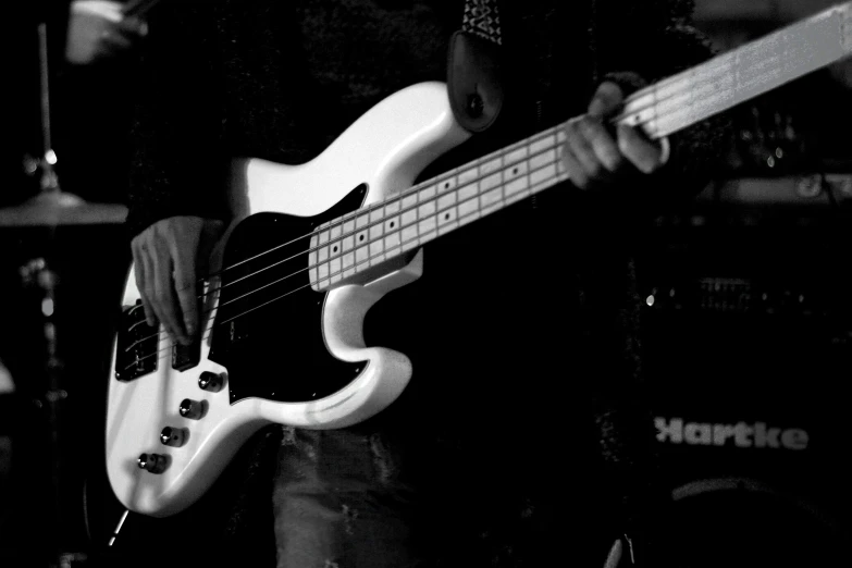 a person is playing a musical instrument in a dark room