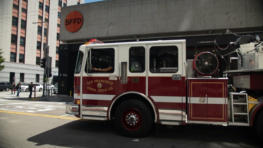 a fire truck is parked on a city street