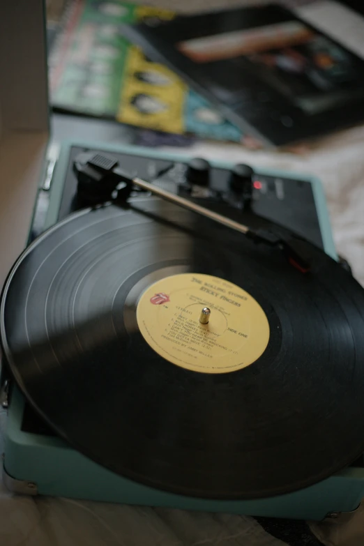 a record player with its turntable on a table
