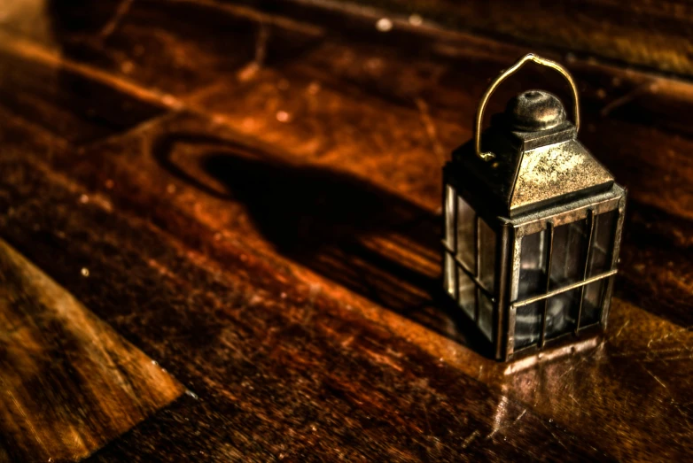 a small lantern is sitting on the table