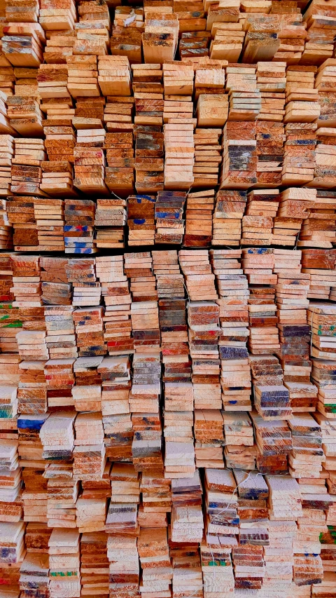 stacks of blocks of wood sitting on the ground
