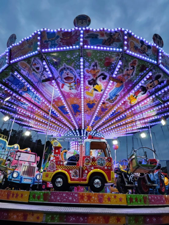 a merry go round ride in a dark night