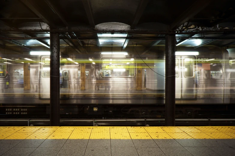 a picture of a train traveling down some tracks