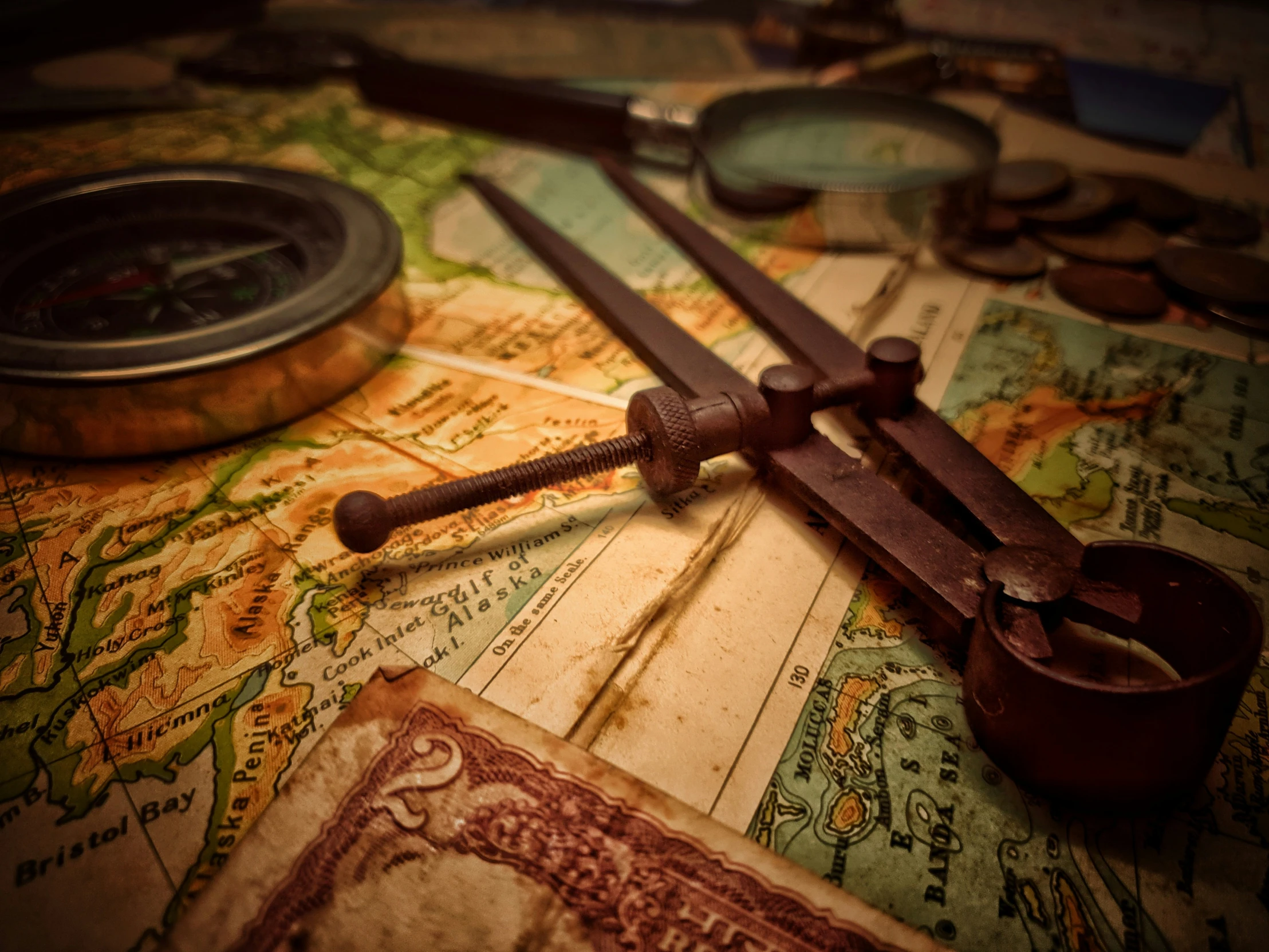 antique scissors and other items sit on top of a map