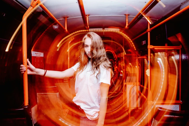 the young woman is trying to take a picture in a tunnel