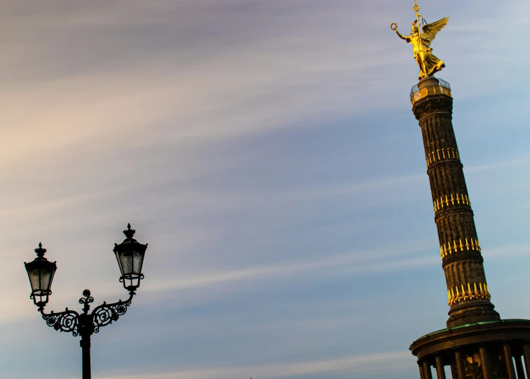 a statue that is on top of a pole