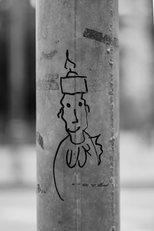 a black and white po of the sticker on the pole