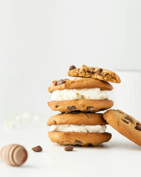 five cookies stacked on top of each other with ice cream and chocolate chips