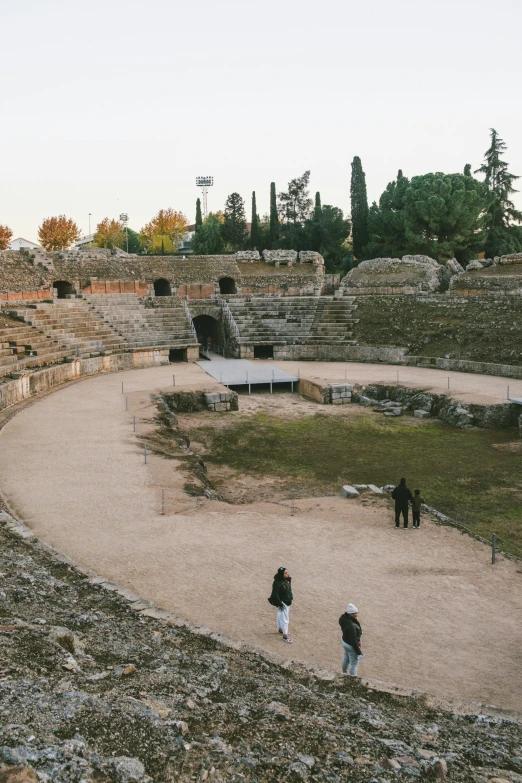 an open air theatre has people looking around