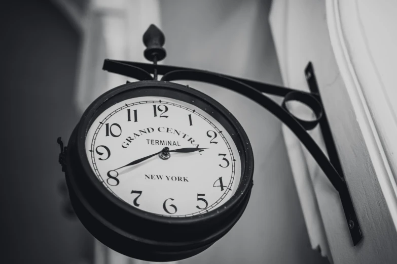 a clock hanging in a room with no numbers