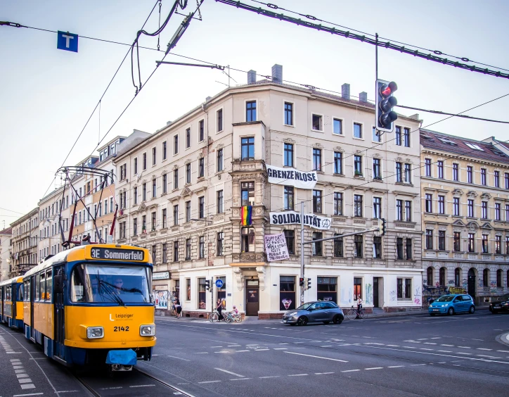 a bus that is going by some buildings