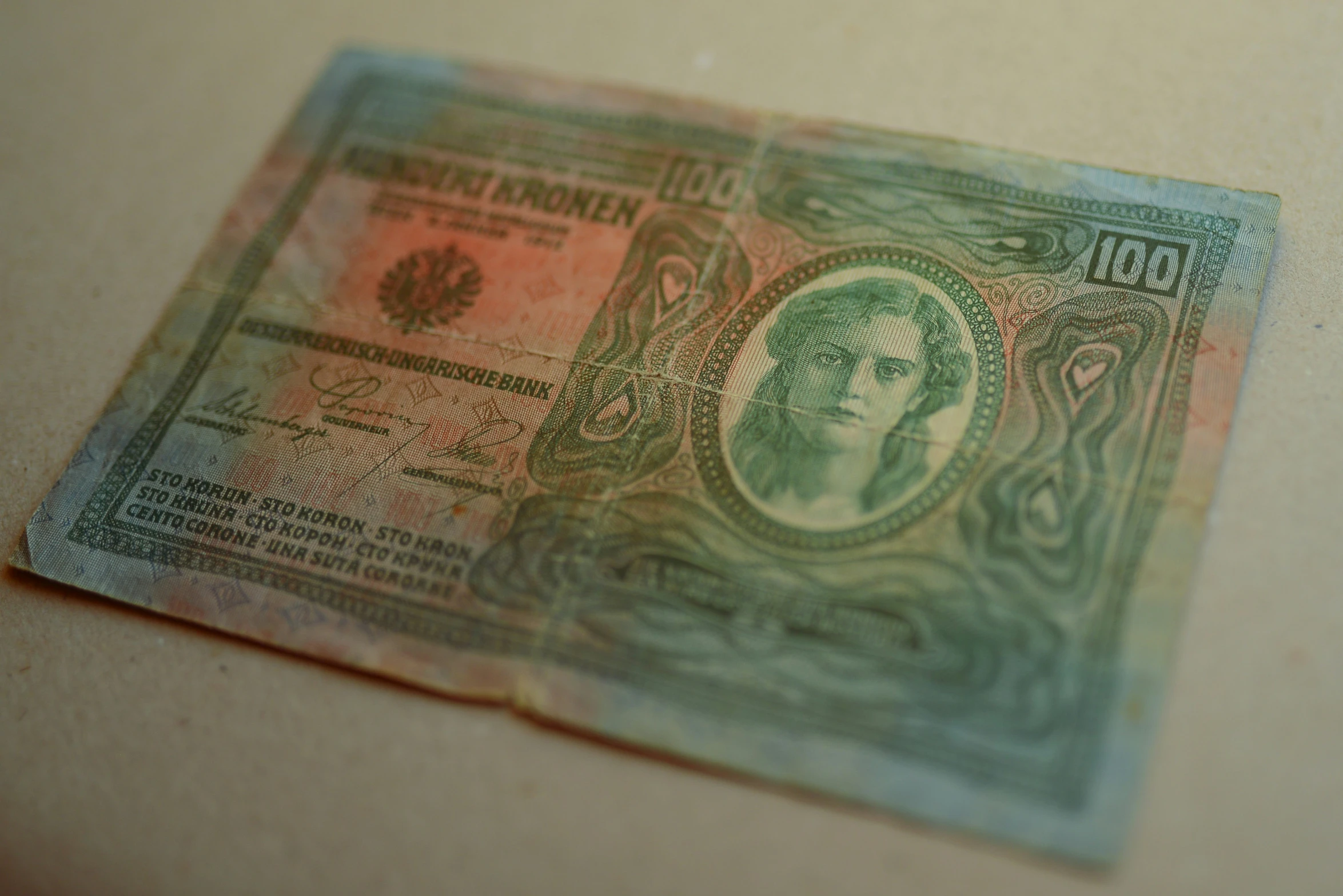 a paper currency bank note lying on a table