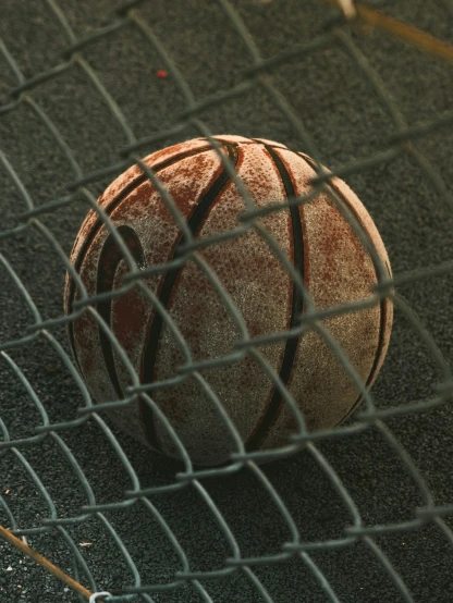 a close up of a tennis ball sitting on a court