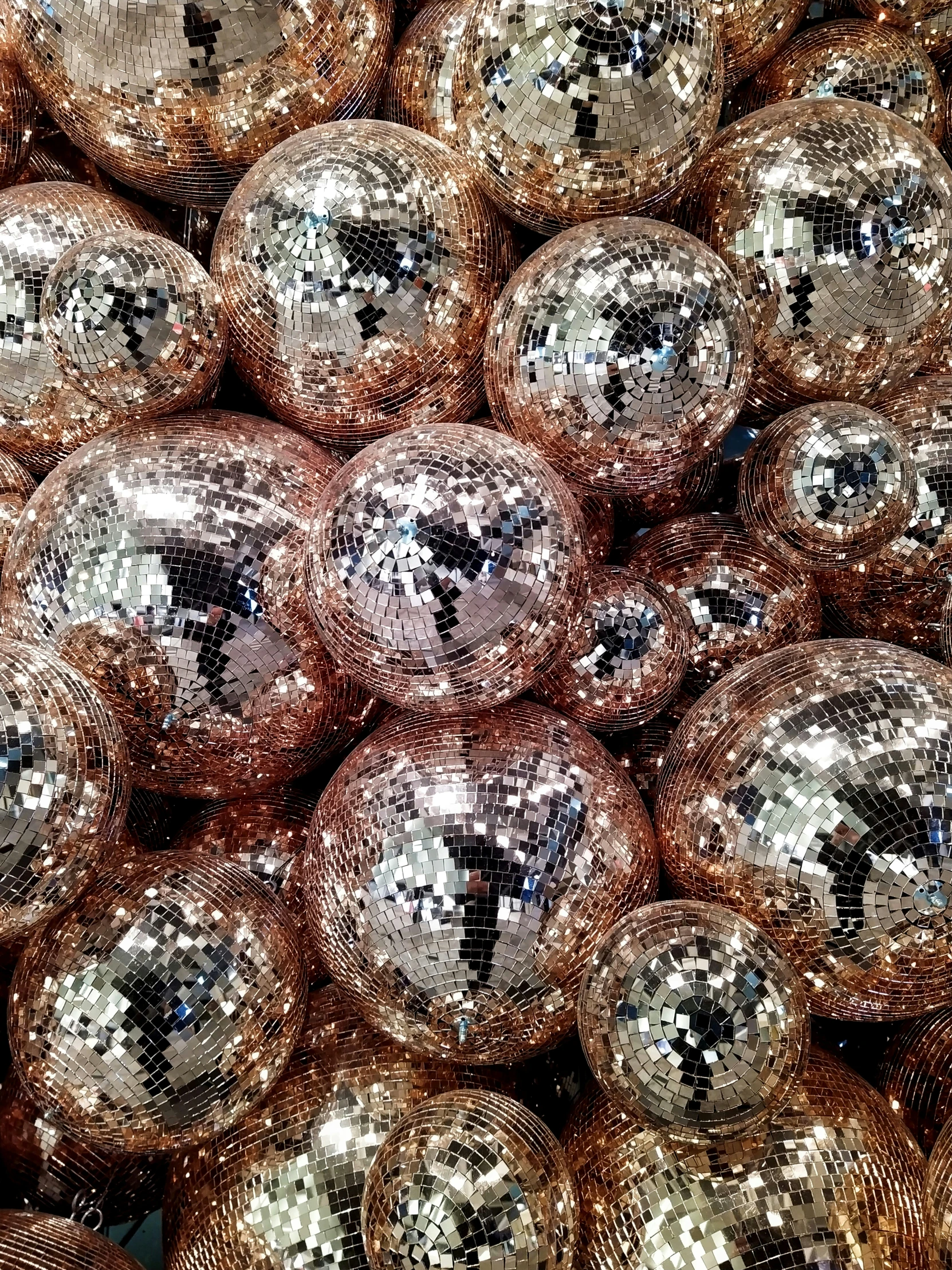 a lot of shiny and metallic balls of different sizes