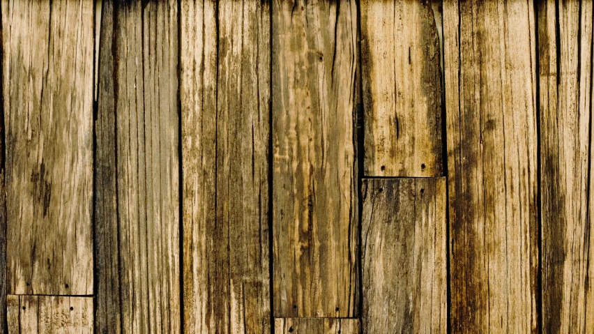 a white clock sitting on the side of a wood fence