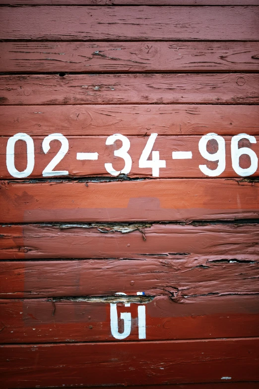 a wood door with white letters written on it