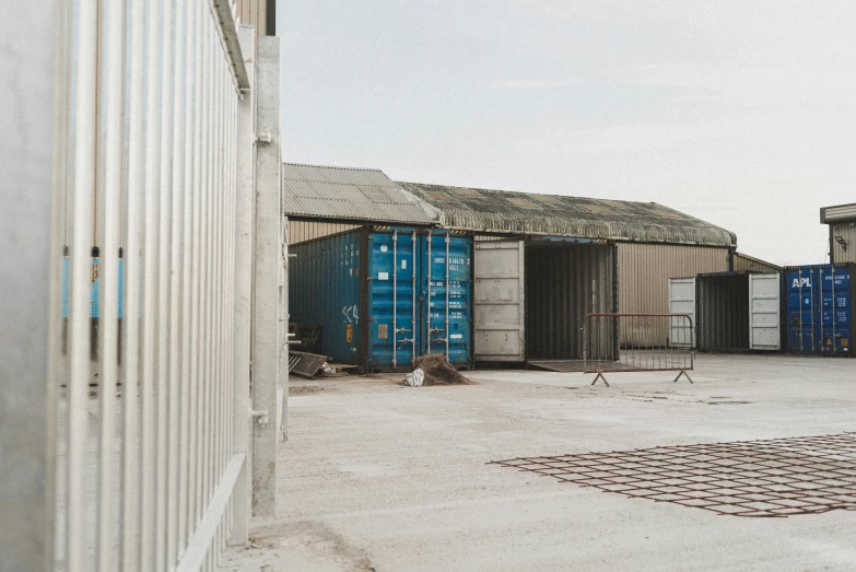 a row of storage containers sitting outside of buildings